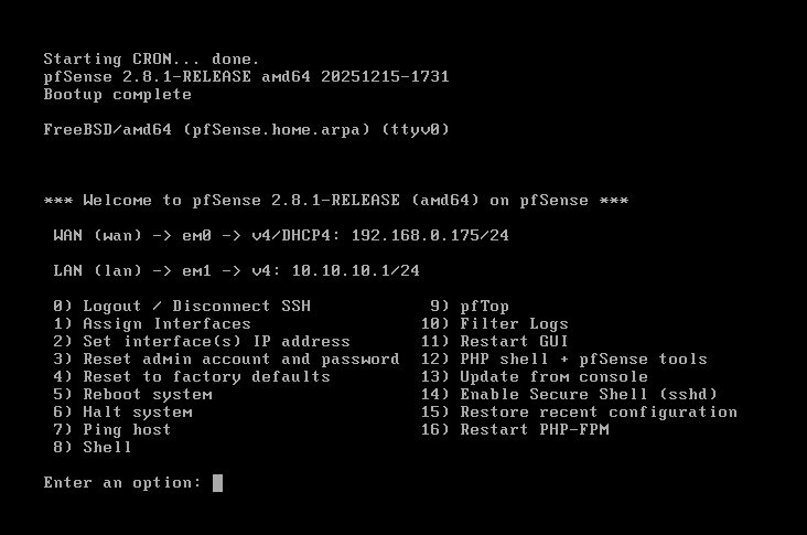 pfSense console menu after successful boot showing WAN assigned to em0 with a DHCP address from the home network and LAN assigned to em1 at 10.10.10.1/24