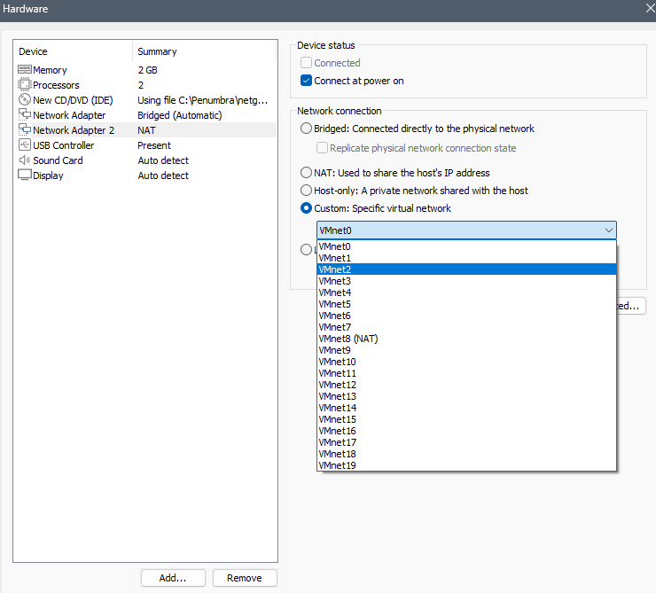 VMware Hardware settings Network Adapter 2 panel showing Custom: Specific virtual network selected and VMnet2 assigned for the LAN interface