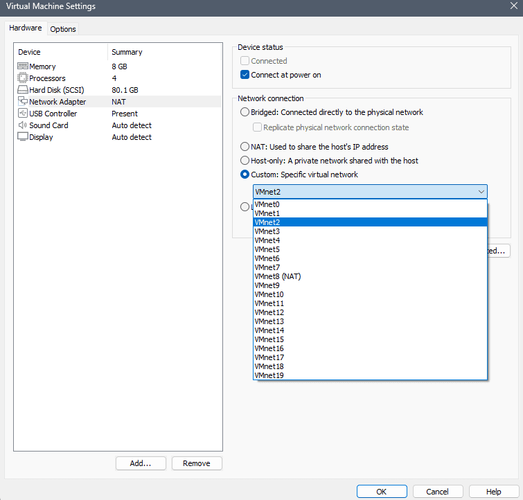 VMware Hardware settings Network Adapter panel for the Kali VM showing Custom: Specific virtual network selected with VMnet2 assigned