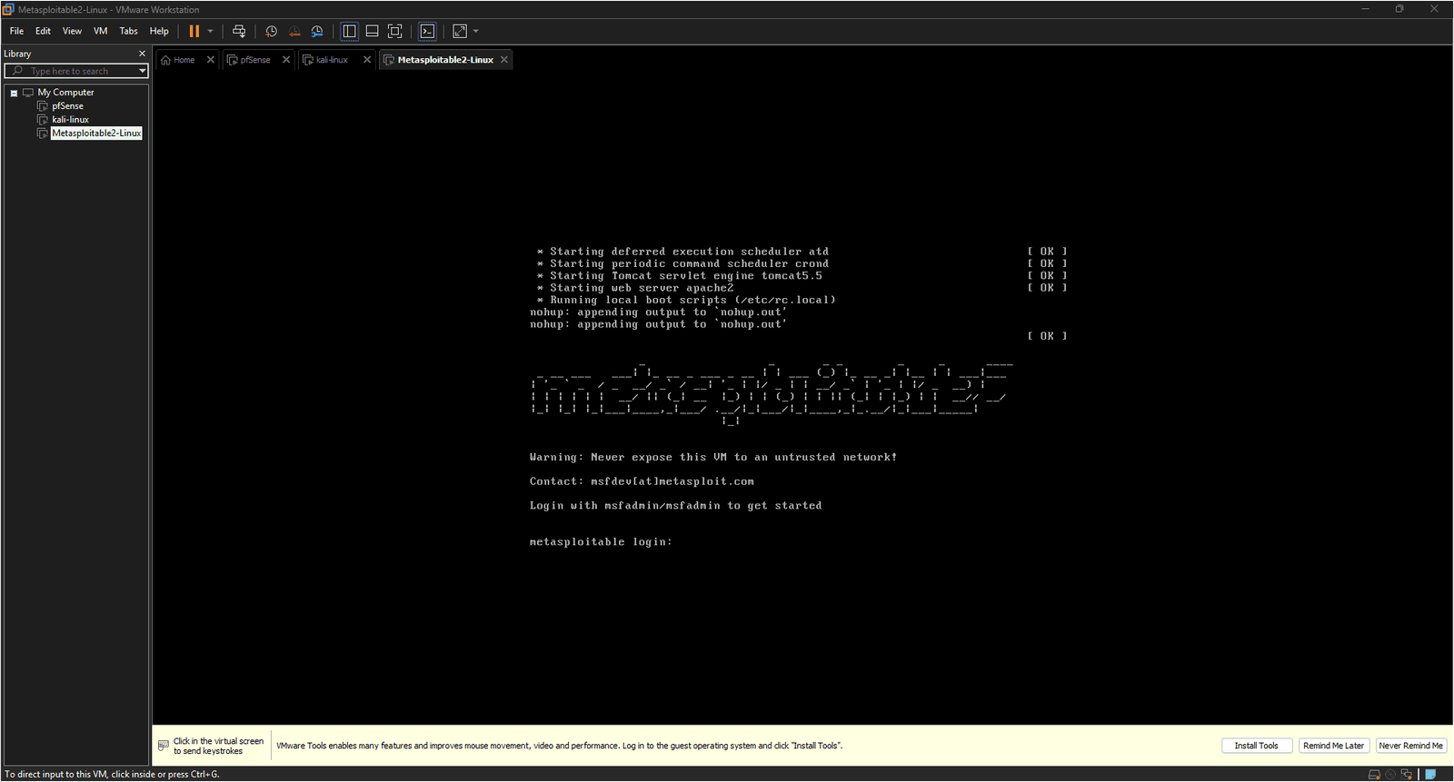 Metasploitable2 console showing the warning banner text Never expose this VM to an untrusted network and the login prompt waiting for credentials